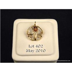 One Madera citrine set in a 14kt gold pendant.  Est. $150-$200.