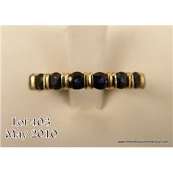 One ladies band set with 12 round cut blue  sapphire(approx wt. 1.00ct). Est. $150-$250.