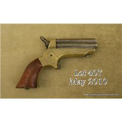 Sharps four barrel derringer, .22 cal., 2-1/2”  iron barrels, brass frame, wood grips, #25573.  This