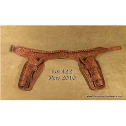 Beautifully and extensively tooled  double loop,  double holster rig for a pair of Colt SAA  revolve