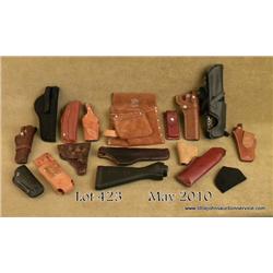 Bonanza lot of leather and miscellaneous gun  related items.  Hoppe's gun cleaning kit, a Bob  sling
