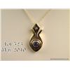 Image 2 : Very stylish 14 karat two-tone gold ladies pendant  set with a nice round Tanzanite a fine diamond. 