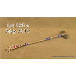 Indian club with stone head and hide-wrapped and  beaded shaft, approx. 21” overall with an attached