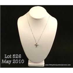 One diamond cross pendant with chain in 14kt white  gold and set with 0.26 ct of diamonds. Est.  $55