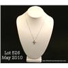Image 1 : One diamond cross pendant with chain in 14kt white  gold and set with 0.26 ct of diamonds. Est.  $55