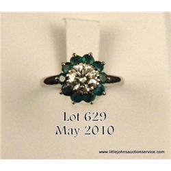 Ladies platinum emerald and diamond ring, round  brilliant cut diamond approx. 0.75 carat  surrounde