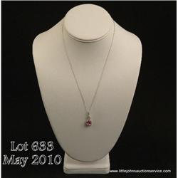 Gorgeous 10 karat white gold ladies vintage style  necklace set with a center oval pink sapphire  we