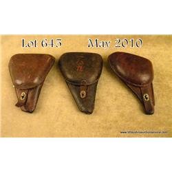 Lot of 3 clamshell leather holsters; One for a  Japanese revolver. Two for Nambus, good to very  goo
