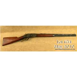 Winchester Model 1873 lever action rifle .38-40  cal., 24” octagon barrel, full magazine, shotgun  b