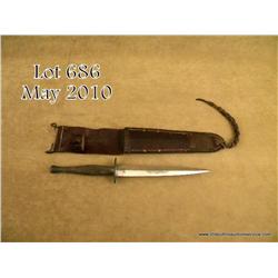 U.S.M.C. issue military fighting knife by Camillus  Cutlery Co., Camillus, NY with etched blade  sho