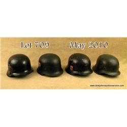 Lot of 4 German helmets with replaced decals.  Three with liners, in various conditions. One  repain