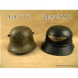 Lot of 2 German air defense helmets; both with  decals. Good to very good condition. One missing  li