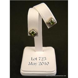 Brilliant 14 karat yellow gold ladies earrings  made by ‘Krementz’ bezel set with two Peridot  weigh