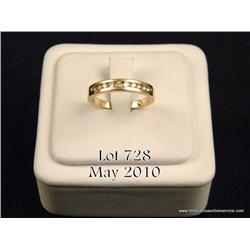 Brilliant 14 karat yellow gold ladies anniversary  design ring channel set with 10 fine cut diamonds