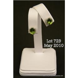 Majestic 14 karat white gold ladies earrings set  with two fine checkerboard cut Peridot weighing  a