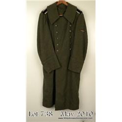 Waffen SS NCO’s winter overcoat made of coarse  field grey wool. Fully lined with blanket  material.