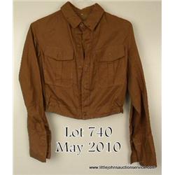 Political leader’s brownshirt complete with  political buttons, collar insignia, and armband.  Shows