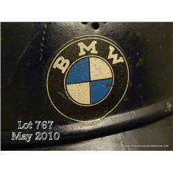 Lot of 3 German air protection helmets; All  original. One bears the decals of the BMW factory  indi