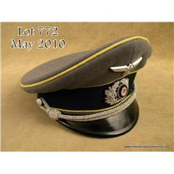 WWII German army communications officer visor cap.  Cap is complete with original insignia, chin cor