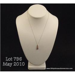 Very elegant 10 karat white gold ladies custom  design pendant set with 5 round blood red rubies  we