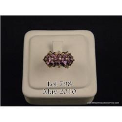 Gorgeous 10 karat yellow gold ladies ring set with  16 square matched purple Amethyst weighing  appr