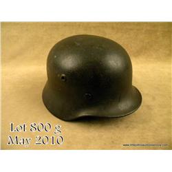 WWII German M40 combat helmet. Retains approx. 90%  of its original field grey finish.  Complete wit