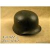 Image 1 : WWII German M40 combat helmet. Retains approx. 90%  of its original field grey finish.  Complete wit
