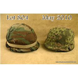 Lot of three helmets: WWII German M40 helmet shell  with field grey painted finish, liner not  prese
