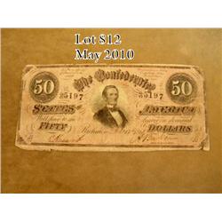 Confederate $50 bill with portrait of Jefferson  Davis on the front and signed by “A. Baker” for  Tr