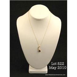 Stylish 14 karat yellow gold ladies pendant set  with a trilliant cut red tourmaline weighing  appro