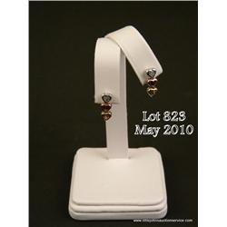 Charming 10 karat tri-color gold ladies earrings  bezel set with citrine, garnet and blue topaz.  Re