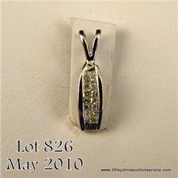 One pendant set with 16 princess cut diamonds in  14k white gold (approx dia. Wt. 0.25 ct.). Est.  $