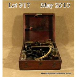 Antique nautical sextant, cased in hinged wood box  with brass telescope and three extra lenses, the