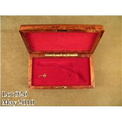 Highly custom exotic wood display case for a Colt  SAA 5-1/2” barrel in overall excellent condition;