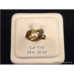 One ladies 14kt yellow gold freeform ring set with  a pearl and two round sapphires. Est. $300-$500.