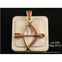 One bow and arrow pendant set with 25  rubies(approx. wt 1.5ct.) set in 14kt yellow gold   (wt.13.37