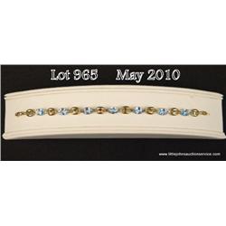 High quality ladies 10 karat yellow gold ladies  bracelet set with seven sky blue topaz weighing  ap