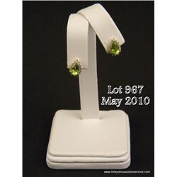 Charming 14 karat yellow gold ladies set with two  matching pear shape Peridot weighing approx. 2.00