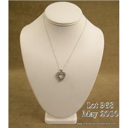 Charming 10 karat white gold ladies heart design  necklace set with 20 round diamonds weighing over 
