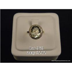 Wonderful 10 karat yellow gold ladies ring set  with a center oval green amethyst weighing over  5.0