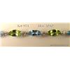 Image 2 : Terrific 10 karat white gold ladies bracelet set  with alternating MQ cut Peridot and blue topaz  we