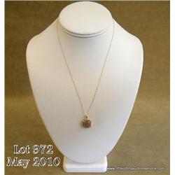 Charming 14 karat yellow gold ladies pendant set  with round pink sapphires and diamonds weighing  a