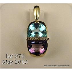 One pearl enhancer cum pendant set with 14kt  yellow gold and set with a half moon cut blue  topaz, 