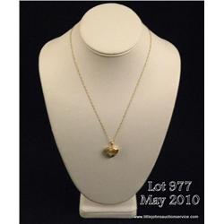 One heart shaped pendant set with 14 diamonds  (0.28ct) in 14kt yellow gold with a chain. Est.  $400