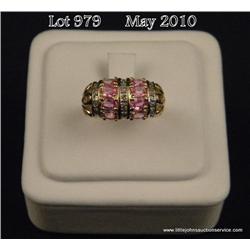Stylish 10 karat yellow gold ladies domed ring set  with eight fine oval pink sapphire weighing  app