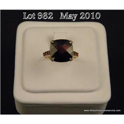 Attractive 14 karat yellow gold ladies custom made  design ring set with a center checkerboard cut  