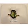 Image 2 : Elegant 10 karat yellow gold ladies ring set with  a center very fine green Peridot weighing approx.