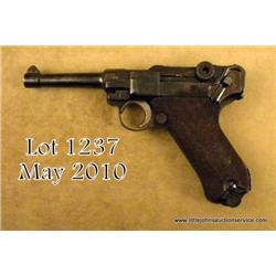 Nazi era Luger by Mauser, breech date 1942, 9mm  cal., nazi proofed, #2231. The pistol shows a  re-b