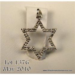 One star pendant set with 0.11ct of diamonds. Est.   $300-$400.