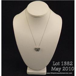 Gorgeous 10 karat white gold ladies butterfly  design pendant set with MQ cut blue topaz and pave  s